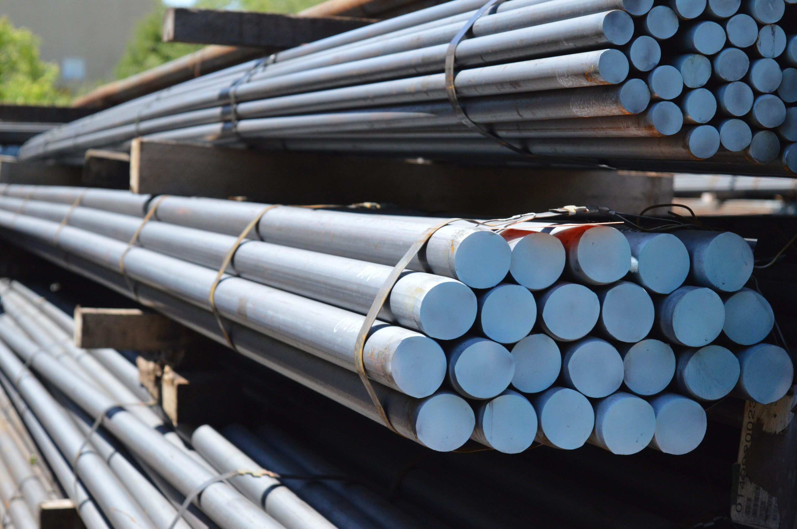 Stacks of metal rods bundled and ready for transport or construction.
